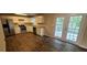 Modern kitchen featuring stainless steel appliances and wood-look flooring at 6050 April Dr, Sugar Hill, GA 30518