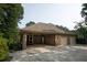 Attached two-car brick garage with covered patio at 3350 Donegal Way, Snellville, GA 30039