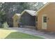 Brick house exterior with screened porch and patio at 3409 Camp Branch Rd, Buford, GA 30519