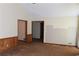 Living room with wood paneling and carpet at 3409 Camp Branch Rd, Buford, GA 30519