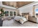 Spacious main bedroom with wood-look floors and a cozy sitting area at 121 Villanueva Rd, Woodstock, GA 30188