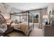 Bedroom with a canopy bed, floral wall mural, and window seating at 121 Villanueva Rd, Woodstock, GA 30188