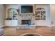Elegant stone fireplace with built-in shelving on either side at 5270 Serenity Sw Ln, Atlanta, GA 30349