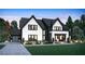 Stunning two-story home with a modern design and dark metal roof at 2030 Fontainbleau Dr, Conyers, GA 30094