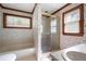 Bathroom with shower, garden-themed wallpaper, and a bathtub at 1827 Lost Mountain Rd, Powder Springs, GA 30127