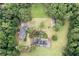 Aerial view of house, tennis court, and expansive yard at 1827 Lost Mountain Rd, Powder Springs, GA 30127