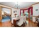Formal dining room offering views of the backyard and access to the kitchen at 1827 Lost Mountain Rd, Powder Springs, GA 30127