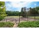 Private tennis courts with ample surrounding space at 1827 Lost Mountain Rd, Powder Springs, GA 30127
