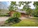 Brick home showcasing the driveway and side yard landscaping at 1827 Lost Mountain Rd, Powder Springs, GA 30127