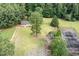 Aerial view showing house, grounds, and tennis court at 1827 Lost Mountain Rd, Powder Springs, GA 30127