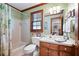 Bathroom with shower/tub combo, wood vanity, and linen closet at 1827 Lost Mountain Rd, Powder Springs, GA 30127