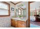 Double vanity bathroom with a shower and view of bedroom at 1827 Lost Mountain Rd, Powder Springs, GA 30127