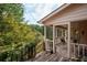 Spacious wooden porch overlooking a lush green landscape at 1827 Lost Mountain Rd, Powder Springs, GA 30127