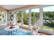 Sunroom with rocking chair and view of backyard at 1827 Lost Mountain Rd, Powder Springs, GA 30127