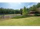 Private tennis courts nestled in a wooded setting at 1827 Lost Mountain Rd, Powder Springs, GA 30127