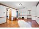 Upstairs bedroom with hardwood floors, walk-in closet, and window at 1827 Lost Mountain Rd, Powder Springs, GA 30127