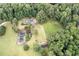 Aerial view showing home, tennis court, and acreage at 1827 Lost Mountain Rd, Powder Springs, GA 30127