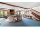 Living area with fireplace, staircase, and lots of natural light at 1827 Lost Mountain Rd, Powder Springs, GA 30127