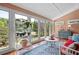 Bright sunroom with terracotta tile floor, and ample natural light at 1827 Lost Mountain Rd, Powder Springs, GA 30127
