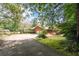 Brick house exterior with attached garage and landscaping at 1827 Lost Mountain Rd, Powder Springs, GA 30127