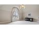 Bright bedroom featuring a large arched window and built-in desk at 895 W Paces Ferry W Rd, Atlanta, GA 30327