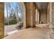 Covered stone porch with arched entryway at 895 W Paces Ferry W Rd, Atlanta, GA 30327