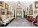 Grand entryway with high ceilings, ornate details, and antique furnishings at 4665 Riverview Rd, Atlanta, GA 30327