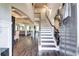 Bright and spacious entryway with hardwood floors and staircase at 1025 Fable Ln, Hampton, GA 30228