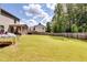 Spacious backyard with a trampoline and covered patio at 1025 Fable Ln, Hampton, GA 30228