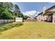 Grass backyard with shed and wooden fence at 1025 Fable Ln, Hampton, GA 30228