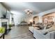 Open living room with hardwood floors and a cozy fireplace at 1025 Fable Ln, Hampton, GA 30228