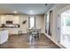 Bright dining area with hardwood floors and access to a patio at 1025 Fable Ln, Hampton, GA 30228