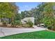 Two-story house with carport and landscaping at 4513 Rivercliff Sw Dr, Lilburn, GA 30047