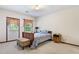 Cozy bedroom with a double bed, window, and private door at 4513 Rivercliff Sw Dr, Lilburn, GA 30047