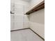 Large walk-in closet with wire shelving and wood trim at 4513 Rivercliff Sw Dr, Lilburn, GA 30047