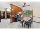 Bright kitchen with dining area, wood cabinetry, and access to deck at 4513 Rivercliff Sw Dr, Lilburn, GA 30047