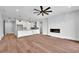 Living room boasts hardwood floors, fireplace, and access to outdoor balcony at 8212 Main St # 1202, Woodstock, GA 30188
