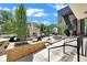 Brick patio with seating, fire pit, and building exterior view at 8212 Main St # 1202, Woodstock, GA 30188
