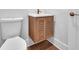Convenient powder room with floating vanity and wood cabinet at 8212 Main St # 1202, Woodstock, GA 30188