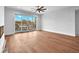 Living room features hardwood floors, fireplace, and sliding doors to balcony at 8212 Main St # 1202, Woodstock, GA 30188