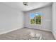 Spacious bedroom with large window and neutral color palette at 8212 Main St # 1202, Woodstock, GA 30188
