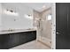 Elegant bathroom featuring a double vanity and a walk-in shower at 8212 Main St # 1300, Woodstock, GA 30188