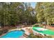 Large pool and patio area with basketball court and landscaping at 1199 Old Lathemtown Rd, Canton, GA 30115
