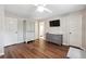 Bedroom with wood floors, dresser, and large closet at 1199 Old Lathemtown Rd, Canton, GA 30115