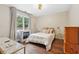 Cozy bedroom featuring fireplace and ample natural light at 1199 Old Lathemtown Rd, Canton, GA 30115