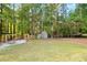 Spacious backyard with shed and fire pit area at 1199 Old Lathemtown Rd, Canton, GA 30115