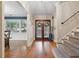 Bright and spacious entryway with hardwood floors and staircase at 1199 Old Lathemtown Rd, Canton, GA 30115