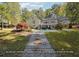 Home's backyard features a pool and a stone pathway at 1199 Old Lathemtown Rd, Canton, GA 30115