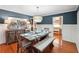 Elegant dining room featuring a farmhouse table and built-in bench at 1199 Old Lathemtown Rd, Canton, GA 30115