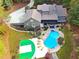Aerial view of house, pool, and backyard sports court at 1199 Old Lathemtown Rd, Canton, GA 30115